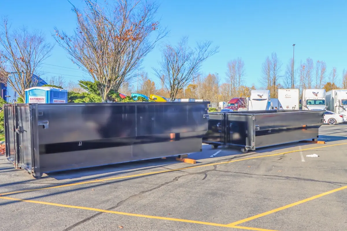 Professional dumpster rental service with roll-off container on residential driveway in Social Circle